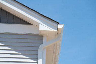 white plastic rain gutter maintenance rain gutter before rainy season new roof corner