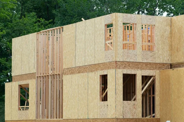 New house construction, framed walls plywood building lumber real truss wooden wall frame material window