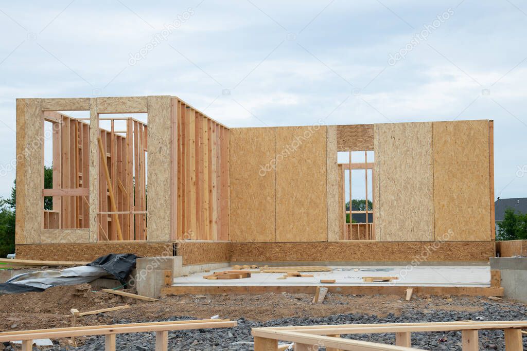 start of construction of a plywood house new wall material framework structure view build