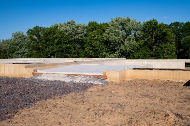 Pouring the foundation for a new house with suburbs development concrete building basement