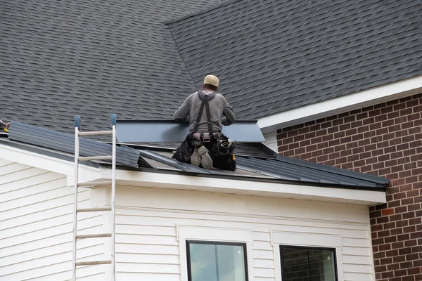 worker making iron roof metal steel professional roofer