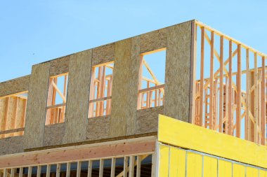 New residential construction home framing against a blue sky wooden construction wood work property view