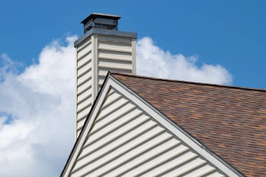 chimney from the fireplace outside house day rooftop smoke modern heat