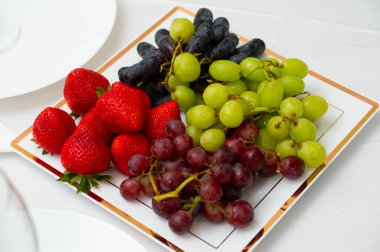 plate with mixed fruits salad diet food colorful