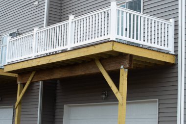 wooden balcony of a new house modern fasade white natural