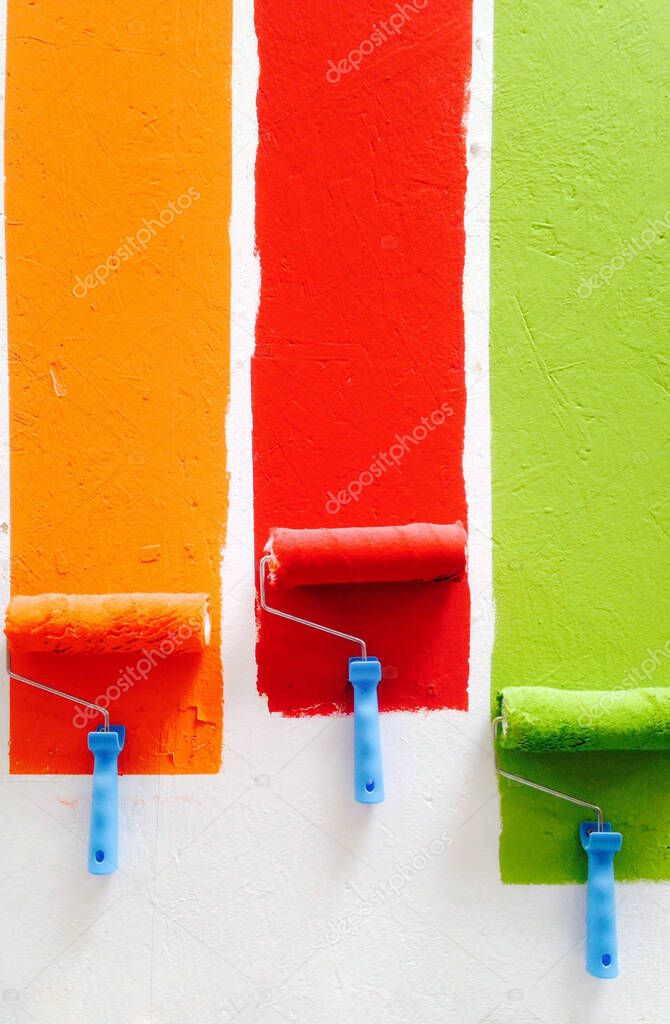 Three Paint rollers of different color