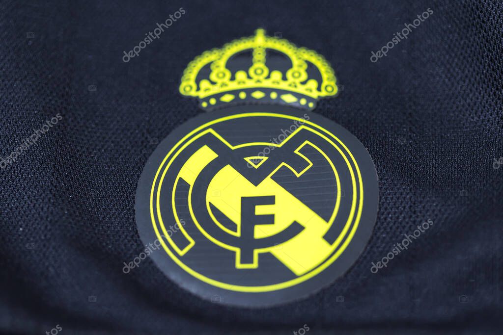 Yellow shield on the gray shirt of Real Madrid Football Club. Uefa champions league final concept on May 28, 2022, champion, europe, league, spain.