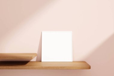 Minimalist and clean square white poster or photo frame mockup on the wooden table leaning against the room wall