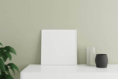 Minimalist ve temiz kare beyaz poster ya da oda duvarına vazo ve bitkiyle yaslanmış beyaz masanın üzerindeki fotoğraf çerçevesi. 3B Hazırlama.
