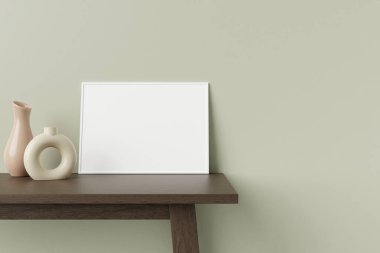 Minimalist ve temiz yatay beyaz poster ya da ahşap masada dekoratif vazoyla duvara yaslanmış fotoğraf çerçevesi modeli. 3B Hazırlama.