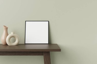 Minimalist ve temiz kare siyah poster ya da ahşap masanın üzerinde dekoratif vazoyla duvara yaslanmış fotoğraf çerçevesi modeli. 3B Hazırlama.