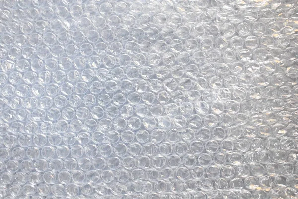 Translucent plastic air bubble packaging textured background