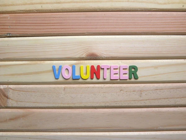 Sukarelawan Word Pada Latar Belakang Kayu — Stok Foto