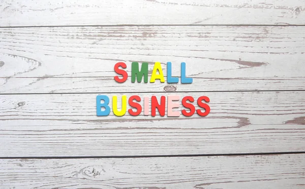 Words Small business on wood background