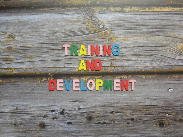 Words Training and development on wood background