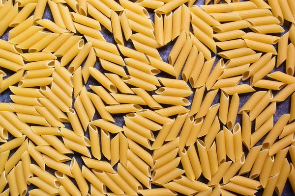 Raw Whole Dried Penne Rigate Pasta — Stock Photo, Image