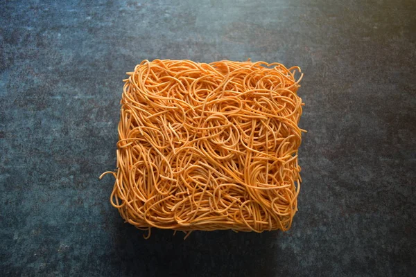 Raw Whole Dried Orange Color Square Noodles Block — Stock Photo, Image