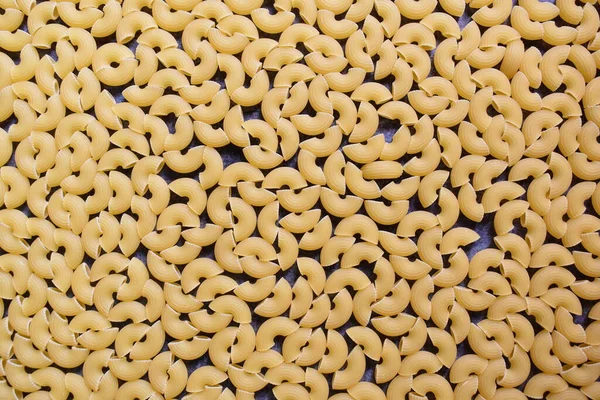 Raw Whole Dried Ridged Elbow Macaroni Pasta — Stock Photo, Image