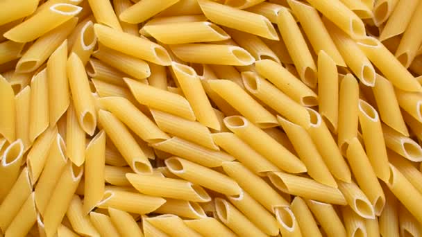 Raw Whole Dried Penne Rigate Pasta — Stockvideo