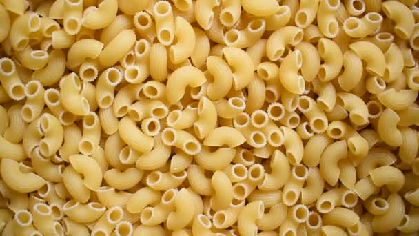Raw Whole Dried Ridged Elbow Macaroni Pasta — Stockvideo