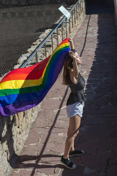Young Woman Holding Raising Rainbow Flag Closed Eyes — Stockfoto