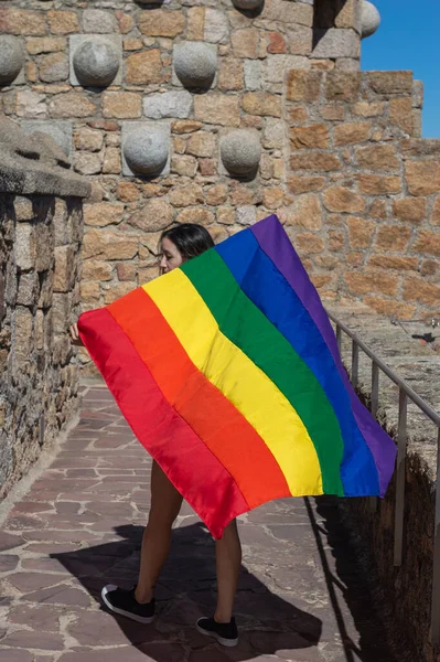 Portrait Attractive Woman Holding Rainbow Flag Her Shoulders Looking Side — Stockfoto