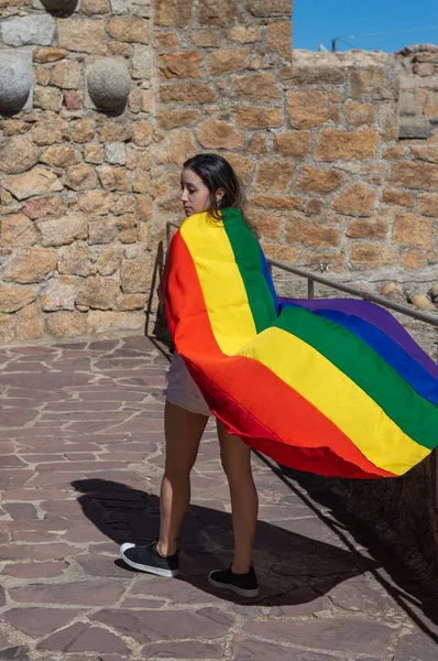 Portrait Attractive Woman Holding Rainbow Flag Her Shoulders Looking Side — Stok fotoğraf