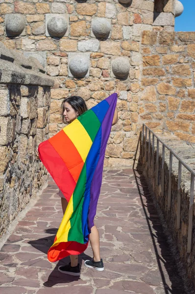Portrait Attractive Woman Holding Rainbow Flag Her Shoulders Looking Side — Stockfoto