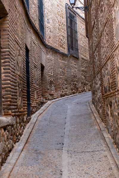Toledo, Spain, UNESCO world heritage site. Old city on the horizon. Detail of narrow street.