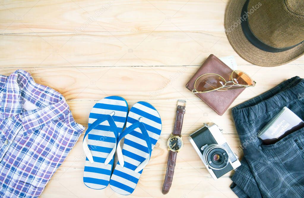 Casual clothing and accessories on the wooden background.