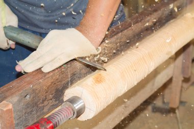 Turner, wood turning, wood furniture factory in Motion blur.