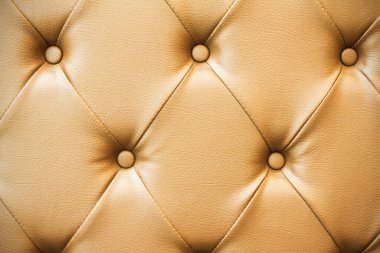 Genuine brown leather upholstery vintage background.