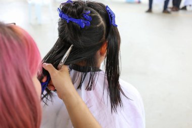 close up hand using fashion cut hair people at the salon shop