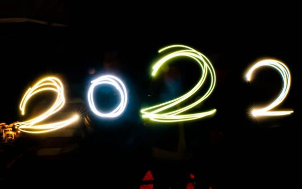 Happy New Year Hand Drawing Light Line Number 2022 Year — Stock Fotó