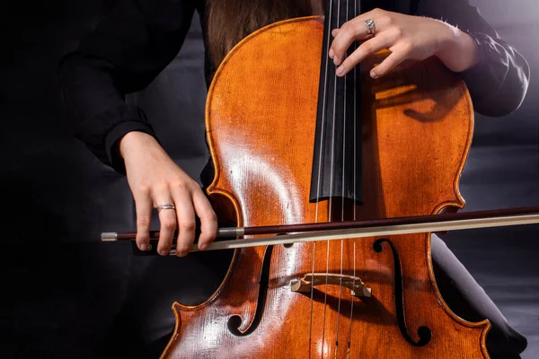 Beautiful girl cellist playing sonata