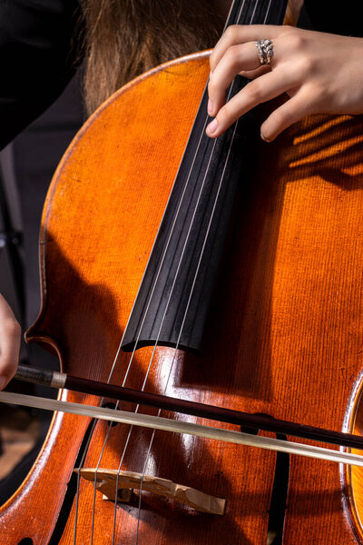 Beautiful girl cellist playing sonata