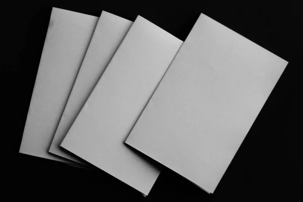 Blank Mock Paper Brochure Magazine Isolated Black Table Changeable Background — 图库照片