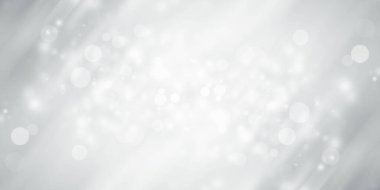 Beyaz ve gri kar, soyut arkaplanı bulanıklaştırdı. Bokeh Noel 'i güzel, parlak Noel ışıklarını bulanıklaştırdı