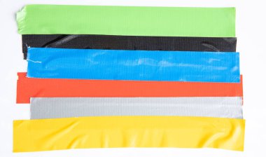 Set of yellow, green, black tapes on white background. Torn horizontal and different size sticky tape, adhesive pieces.
