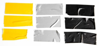 Set of yellow, gray, black tapes on white background. Torn horizontal and different size sticky tape, adhesive pieces.
