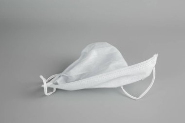 face mask on gray background. concept a protective mask covering the nose and mouth or nose.