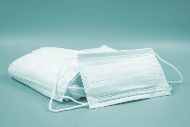 face mask on blue background. concept a protective mask covering the nose and mouth or nose.