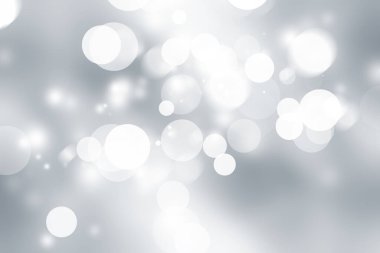 Beyaz bulanık arkaplan. Bokeh Noel 'i güzel, parlak Noel ışıklarını bulanıklaştırdı