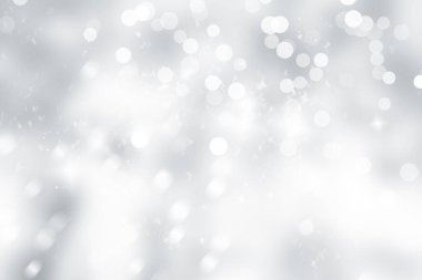 Beyaz kar taneleri bulanık gri arka planda, Lüks Noel 'de pırıl pırıl parlıyor.
