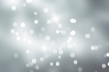 Beyaz kar taneleri bulanık gri arka planda, Lüks Noel 'de pırıl pırıl parlıyor.