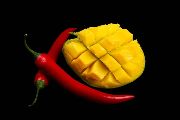 Cutted Mango Two Whole Chili Peppers Black Background Ingredients Spicy — Stockfoto