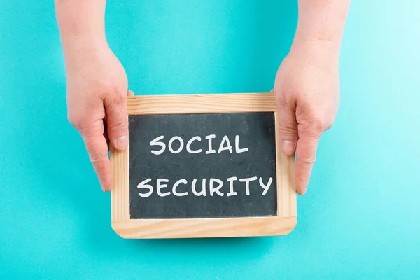 The words social security are standing on a chalkboard