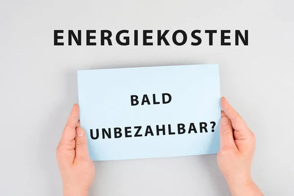 Energy prices soon unaffordable is standing in german language on the paper, increasing prices , high living expenses, gas and electricity costs, inflation