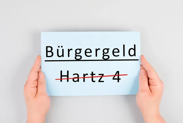 The german word for citizen money is standing on a paper, Hartz 4 is crossed out, new financial help system for unemployment in Germany, social issue
