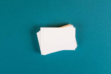 Pile of blank business cards, copy space for text, marketing and advertising concept 